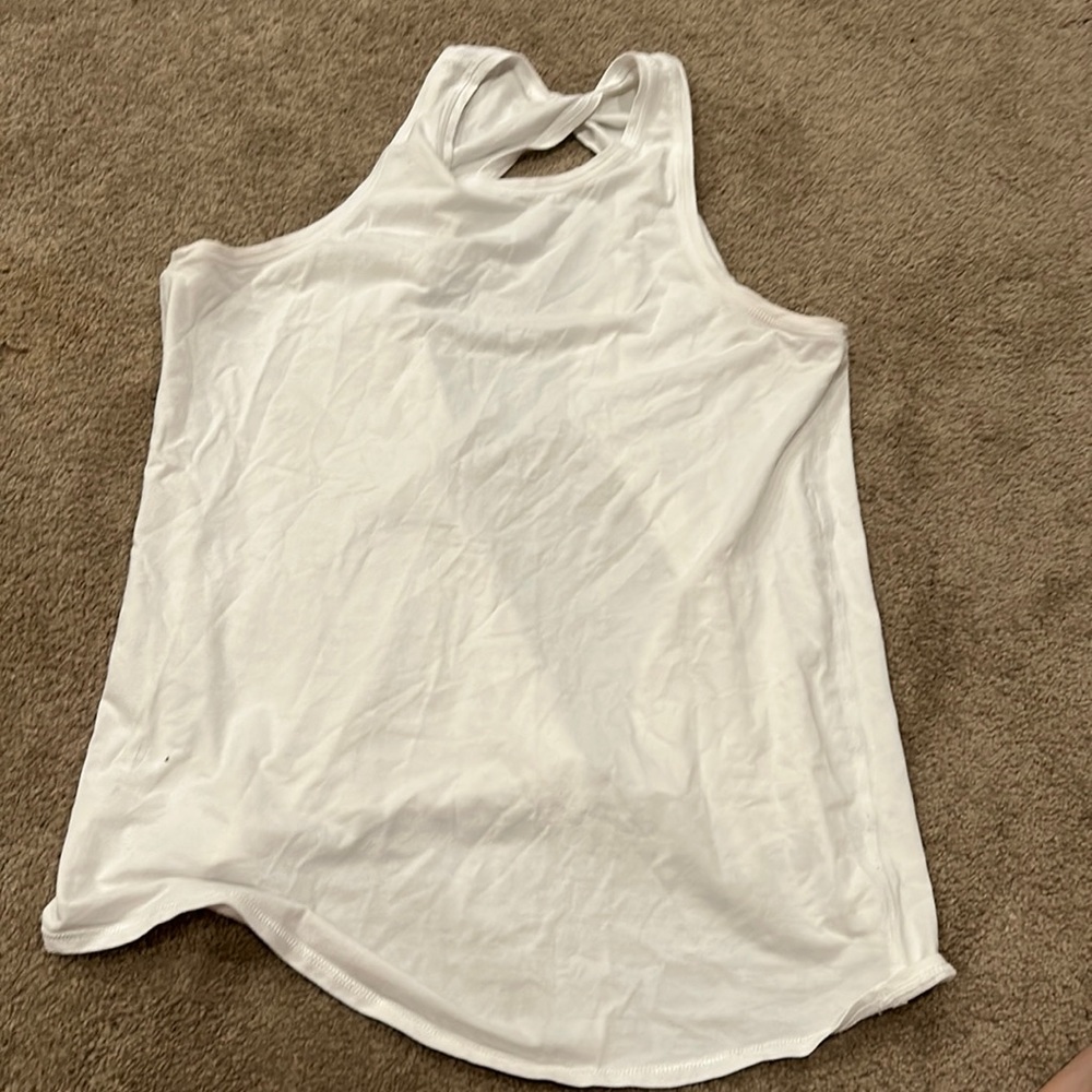 Lululemon split back tank top. Size 4. White. In good used shape